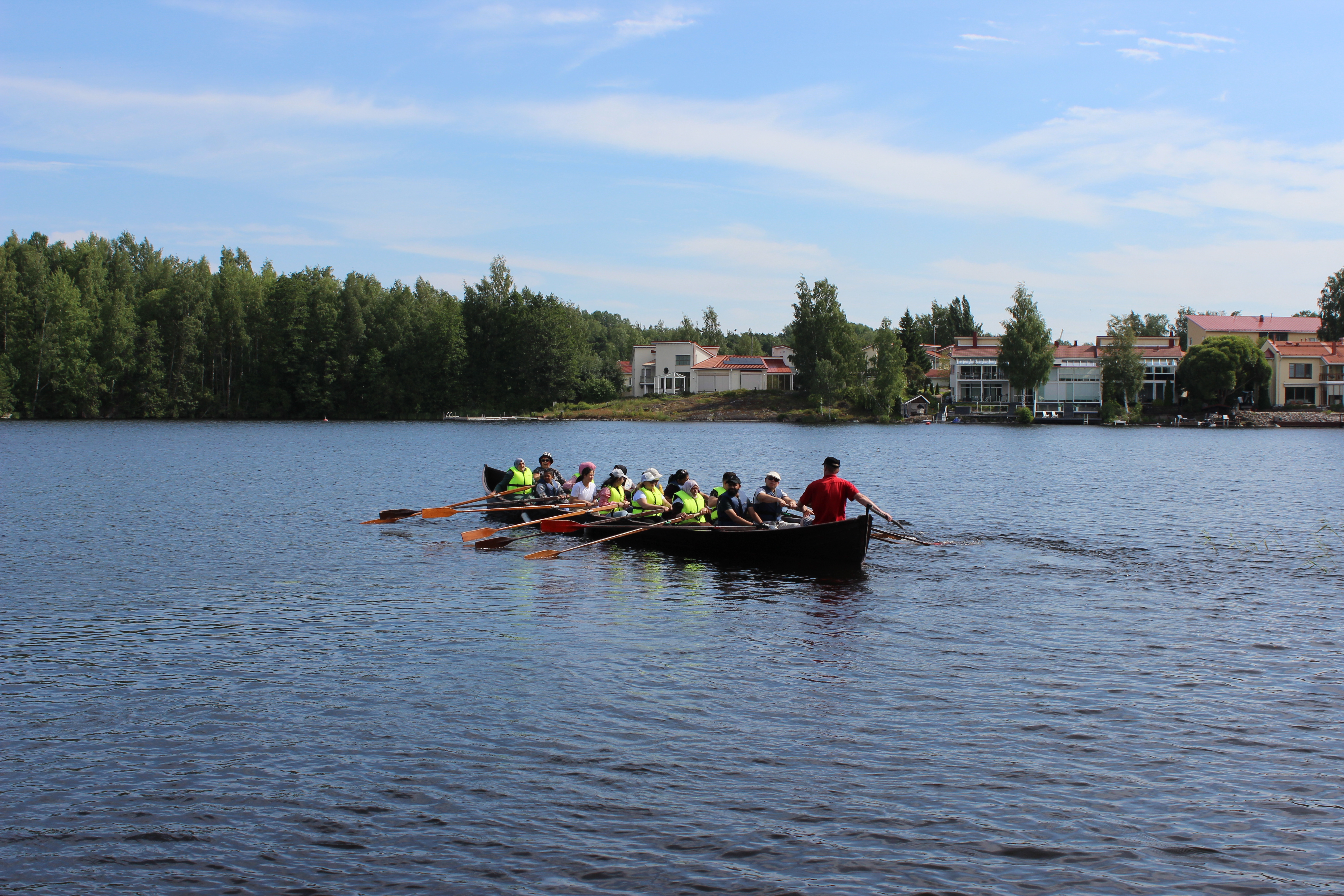People rowing a boat.